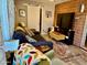 Cozy living room with a comfortable sofa, brick accent wall and modern decor at 4008 W Citrus Way, Phoenix, AZ 85019