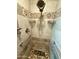 Tiled shower with mosaic accents, grab bars and a built-in seat at 4008 W Citrus Way, Phoenix, AZ 85019