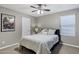 Bedroom with a comfy bed, bright natural light from the window, and simple yet stylish decor at 41311 W Elm Dr, Maricopa, AZ 85138
