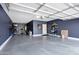 Spacious three car garage featuring ample storage and epoxy flooring at 41311 W Elm Dr, Maricopa, AZ 85138