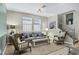Cozy living room with neutral tones, comfortable seating, and ample natural light for relaxation and entertainment at 41311 W Elm Dr, Maricopa, AZ 85138