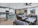 Inviting living space with an open-concept design, seamlessly connecting the kitchen and dining area for easy living at 41311 W Elm Dr, Maricopa, AZ 85138