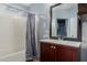 Bathroom featuring a shower and bathtub combination, along with a modern vanity sink at 41373 W Coltin Way, Maricopa, AZ 85138
