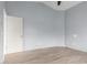 An empty bedroom with laminate flooring and a ceiling fan at 41373 W Coltin Way, Maricopa, AZ 85138