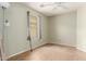 Bedroom with pale green walls and neutral tile flooring at 41373 W Coltin Way, Maricopa, AZ 85138