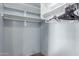 Spacious walk-in closet featuring white shelves and ample storage space at 41373 W Coltin Way, Maricopa, AZ 85138