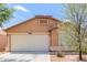 Charming single-story home with a two-car garage and well-maintained front yard at 41373 W Coltin Way, Maricopa, AZ 85138