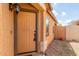 Close up of front entryway and door with sidelight window and desert landscaping at 41373 W Coltin Way, Maricopa, AZ 85138