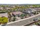 Expansive aerial shot of a single-Gathering home showcasing its well-maintained landscaping and a three car garage at 4671 N 185Th Ln, Goodyear, AZ 85395