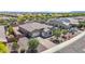 Expansive aerial shot of a single-Gathering home showcasing its well-maintained landscaping and a three car garage at 4671 N 185Th Ln, Goodyear, AZ 85395