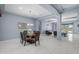 Elegant dining room with coffered ceilings, a chandelier, and views into the living room at 4671 N 185Th Ln, Goodyear, AZ 85395