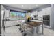 Modern kitchen with granite countertops, stainless steel appliances, and a large island with seating at 4671 N 185Th Ln, Goodyear, AZ 85395