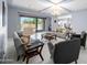 Bright living room featuring tile flooring, contemporary furniture, and a sliding door to the backyard at 4671 N 185Th Ln, Goodyear, AZ 85395