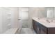 Stylish bathroom with a dual-sink vanity and a shower visible in the mirror's reflection at 5041 S 252Nd Ave, Buckeye, AZ 85326