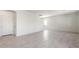 Open-concept living space features neutral tile flooring and ample natural light at 5041 S 252Nd Ave, Buckeye, AZ 85326