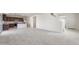 Bright, open-concept living space connects to a modern kitchen with granite countertops and stainless steel appliances at 5041 S 252Nd Ave, Buckeye, AZ 85326