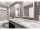 Beautiful bathroom with dual sinks, granite countertops, and tile shower-tub at 5754 W Larkspur Dr, Glendale, AZ 85304