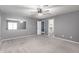 Bedroom with mirror, walk-in closet, and freshly cleaned carpet at 5754 W Larkspur Dr, Glendale, AZ 85304