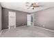 Spacious bedroom featuring closet, fresh carpet, and neutral paint at 5754 W Larkspur Dr, Glendale, AZ 85304
