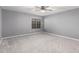 Bedroom featuring large window, neutral paint, and plush carpet at 5754 W Larkspur Dr, Glendale, AZ 85304