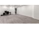 Spacious bedroom features neutral carpet, fresh paint, and adjacent staircase at 5754 W Larkspur Dr, Glendale, AZ 85304