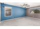 Large bedroom featuring large windows and plush carpet flooring at 5754 W Larkspur Dr, Glendale, AZ 85304