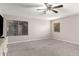 Bedroom featuring neutral walls, plush carpet, and natural light through windows at 5754 W Larkspur Dr, Glendale, AZ 85304