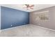 Large bedroom features fresh paint, comfortable carpet, and bright natural light at 5754 W Larkspur Dr, Glendale, AZ 85304