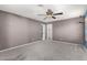 Neutral bedroom featuring fresh carpet and closet at 5754 W Larkspur Dr, Glendale, AZ 85304