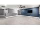 Large bonus room featuring ceiling fan, plush carpet, and durable vinyl flooring at 5754 W Larkspur Dr, Glendale, AZ 85304