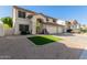 Charming two-story home with a three-car garage, desert landscaping, and a red tile roof at 5754 W Larkspur Dr, Glendale, AZ 85304