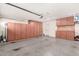 Attached garage with lots of cabinet and storage space at 5754 W Larkspur Dr, Glendale, AZ 85304