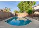 Private backyard pool and lush greenery make this the perfect outdoor oasis for relaxation and entertainment at 5754 W Larkspur Dr, Glendale, AZ 85304