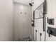 Walk-in shower featuring a rain shower head and modern fixtures at 5754 W Larkspur Dr, Glendale, AZ 85304