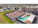 Aerial view of community pickleball courts, swimming pool, and residential buildings at 720 S Rosemont --, Mesa, AZ 85206