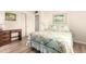 Bedroom with light walls, a bed, and a writing desk under a window at 720 S Rosemont --, Mesa, AZ 85206
