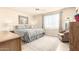 Cozy bedroom with a ceiling fan, light walls and a window offering natural light at 720 S Rosemont --, Mesa, AZ 85206