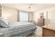 Bright bedroom features a ceiling fan, light walls, and a large window for ample natural light at 720 S Rosemont --, Mesa, AZ 85206