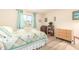 Bedroom with light walls, a comfortable bed, a large window, and a ceiling fan at 720 S Rosemont --, Mesa, AZ 85206