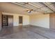 Spacious garage with brick walls, storage shelves and a door to the exterior at 720 S Rosemont --, Mesa, AZ 85206