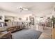 Inviting living area with comfortable seating, modern flooring, and a seamless transition to the dining and kitchen spaces at 720 S Rosemont --, Mesa, AZ 85206