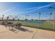 Fenced community tennis court area with seating at 720 S Rosemont --, Mesa, AZ 85206