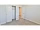 Bedroom featuring neutral carpet, closet, and open doorway at 7531 E Billings St # 131, Mesa, AZ 85207