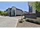 View of modern townhomes with gray and white exteriors and a sign for Aspire Sun Valley community at 7531 E Billings St # 131, Mesa, AZ 85207