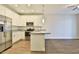 Stylish kitchen with granite counters, stainless appliances and a dining area at 7531 E Billings St # 131, Mesa, AZ 85207