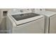 Modern laundry room showcasing a white Samsung washer and dryer set at 7531 E Billings St # 131, Mesa, AZ 85207