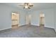 Spacious main bedroom with plush carpet and ensuite bathroom and walk-in closet at 7531 E Billings St # 131, Mesa, AZ 85207