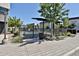 Gated community pool entrance with seating, landscaping and contemporary townhome architecture at 7531 E Billings St # 131, Mesa, AZ 85207