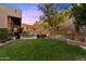 Expansive backyard with lush lawn, patio, outdoor kitchen, and hillside views, perfect for entertaining and relaxation at 7631 N 20Th St, Phoenix, AZ 85020