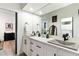 Elegant bathroom with double vanity, granite countertop, and modern fixtures at 7631 N 20Th St, Phoenix, AZ 85020
